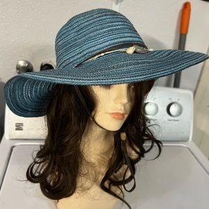 Blue woven sun hat with shell accents